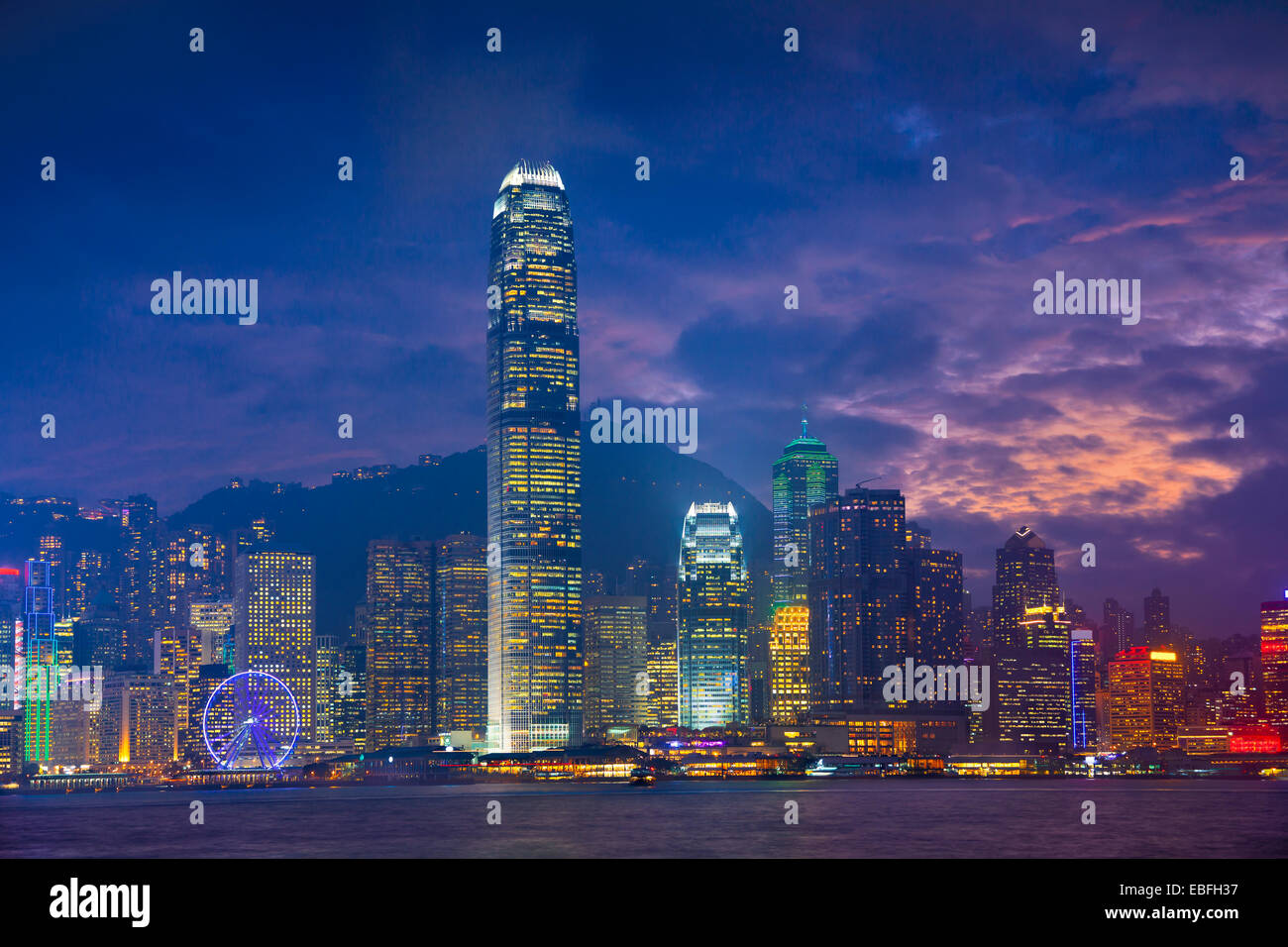 Hong Kong. Image of Hong Kong with many skyscrapers during dramatic sunset. Stock Photo
