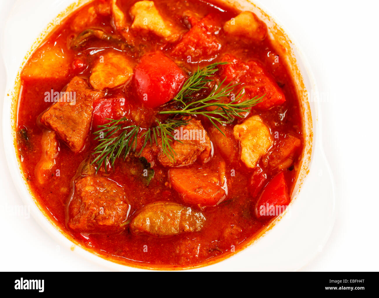 goulash soup in soup plate, on white background Stock Photo - Alamy