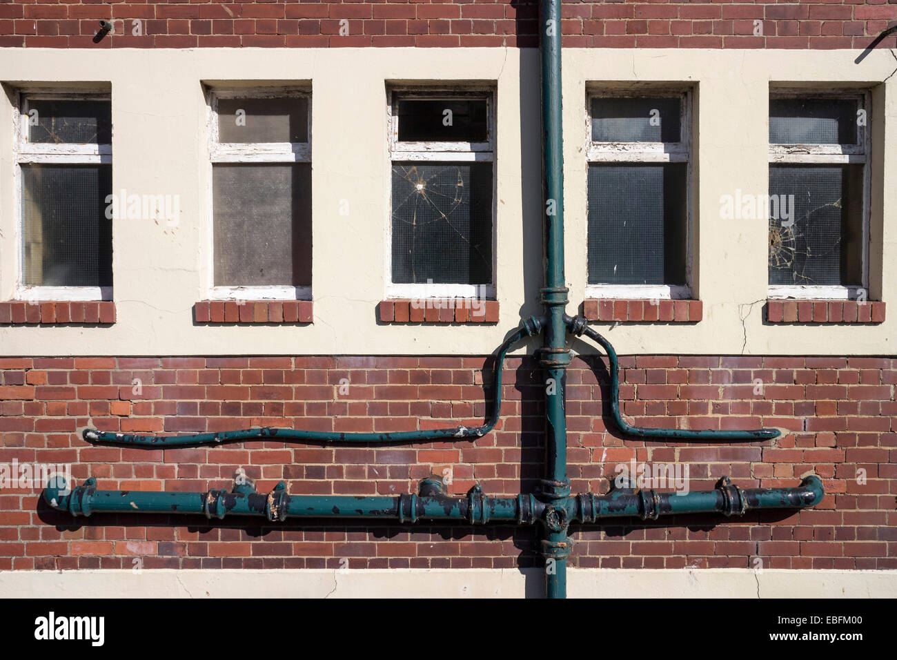 Windows and drains in toilet block, Whitby, North Yorkshire. Stock Photo