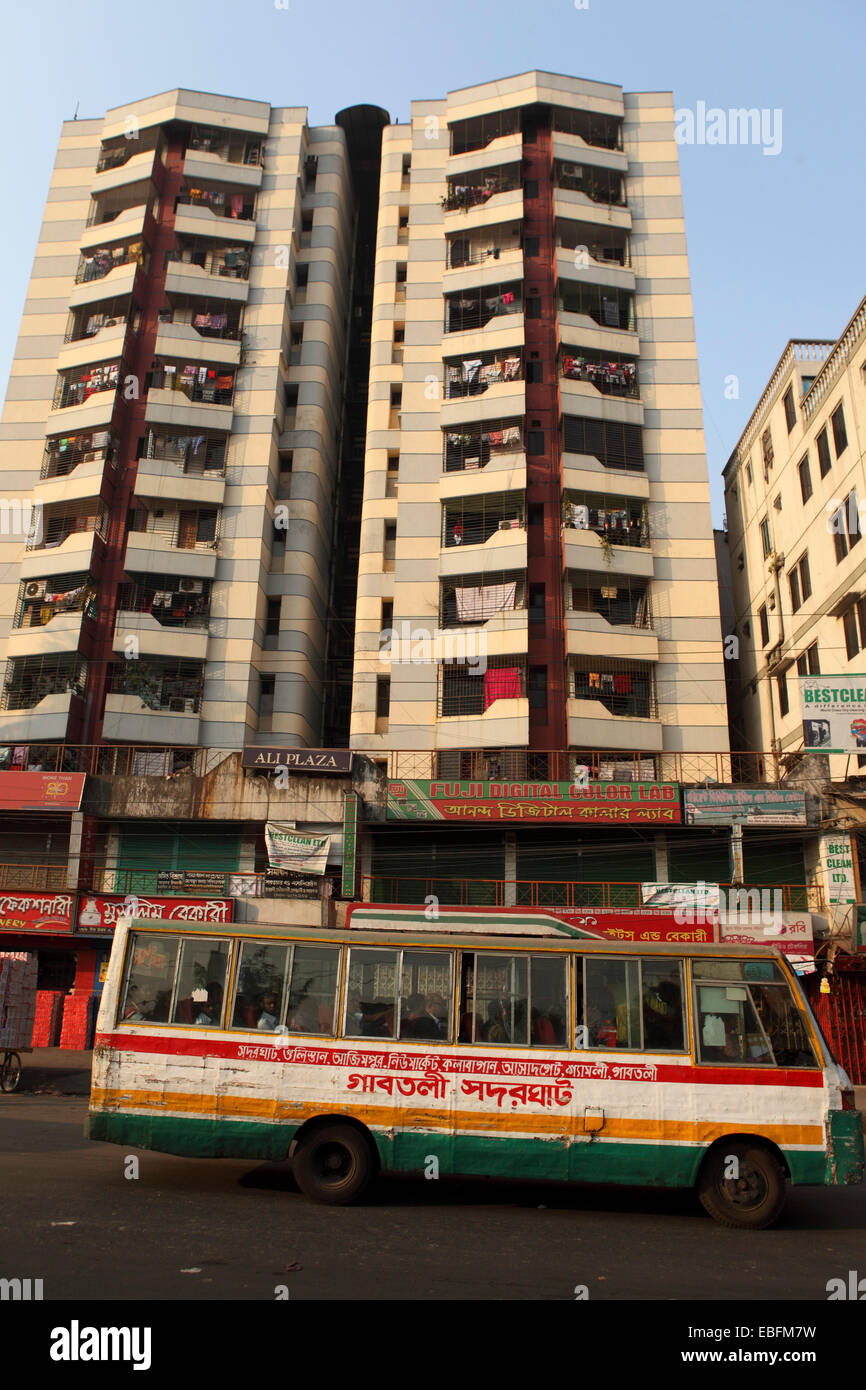 A bus on a street in Dhaka, Bangladesh. The bus shows signs of wear and tear. Stock Photo