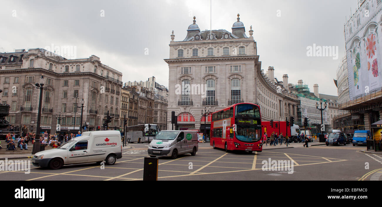 Wide shot of People and traffic, including a double decker bus at the edge of Regent street, central London. Stock Photo