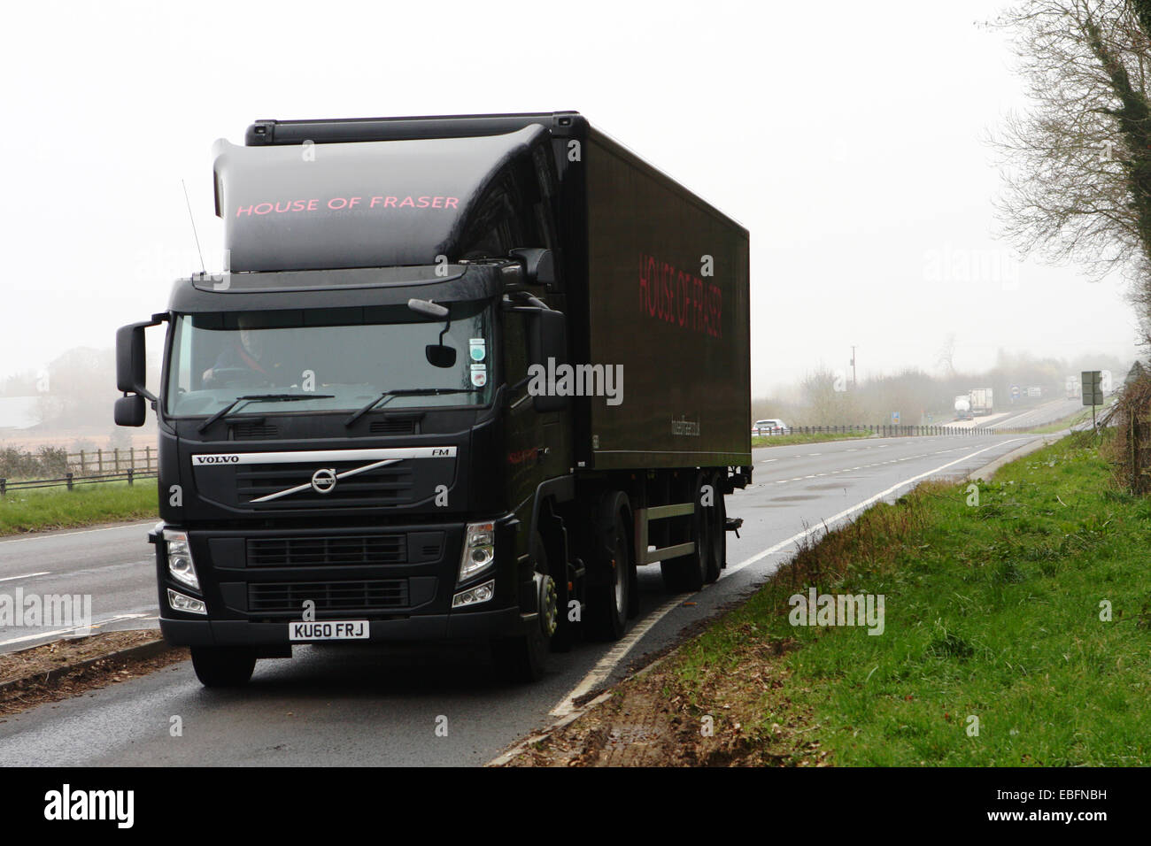 A House of Fraser truck driving into a lay-by on the A417 dual carriageway in the Cotswolds, England Stock Photo