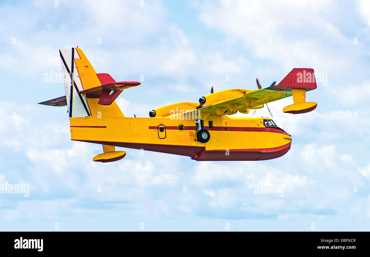 Aerial firefighting.  Aircraft preparing to collect sea water. Stock Photo