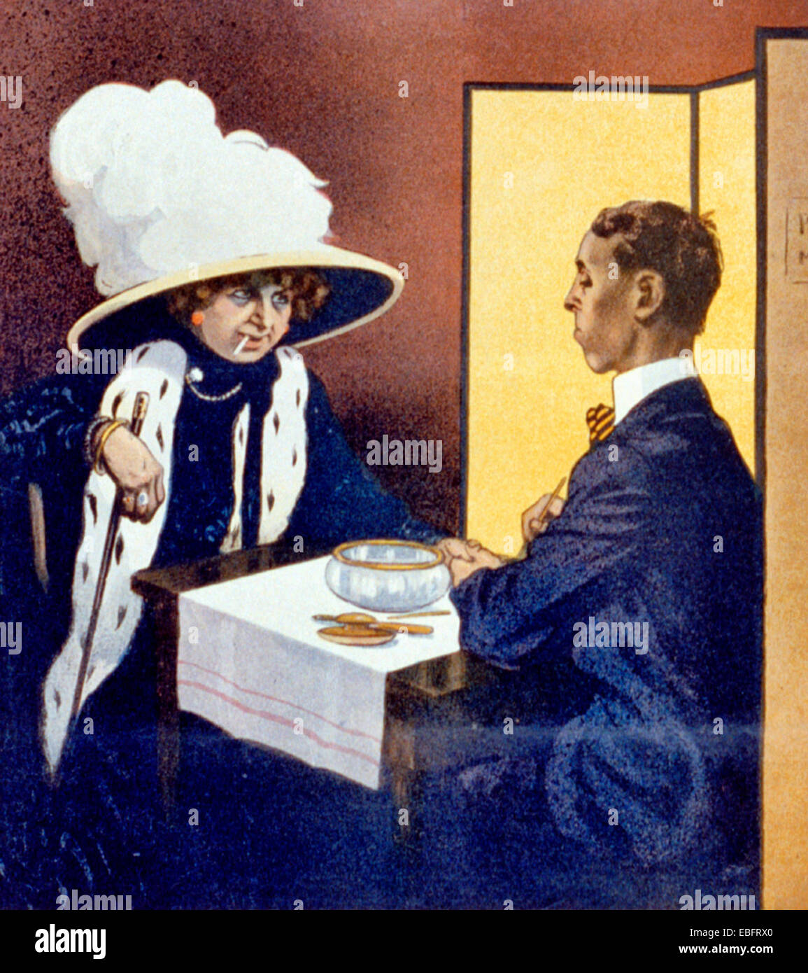 The Manicure in the Age of the Suffragette - Fancy woman, with cigarette in mouth, receiving manicure from a man, circa 1910 Stock Photo