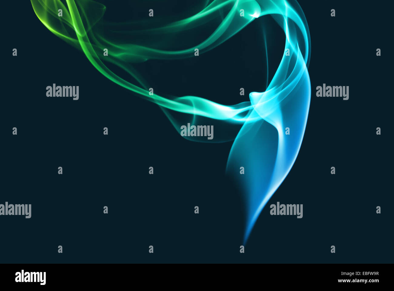 Abstract blue and green smoke on a dark background Stock Photo - Alamy