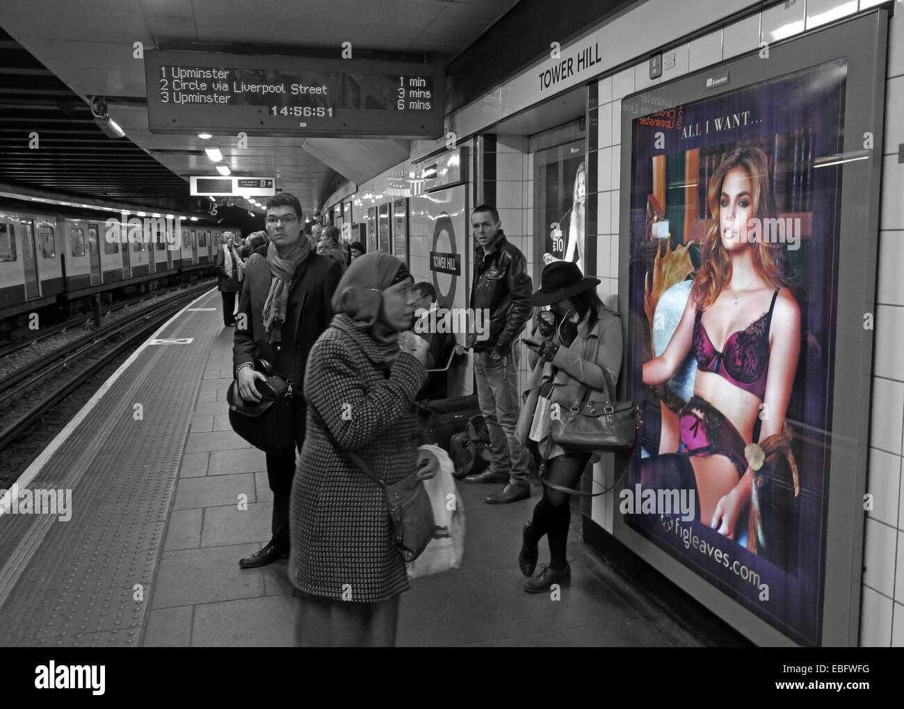 'All I want' poster for lingerie at Moorgate, London City Underground platform, England, UK in selective colour Stock Photo