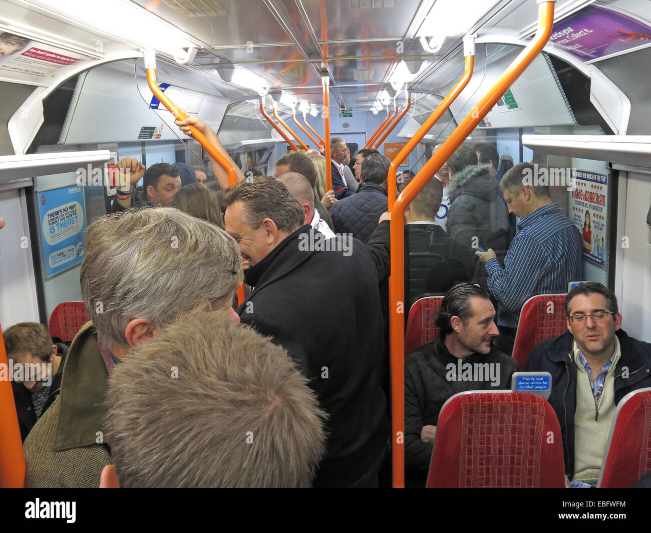 Overcrowded South West Train bound for London Waterloo railway station, England, UK Stock Photo