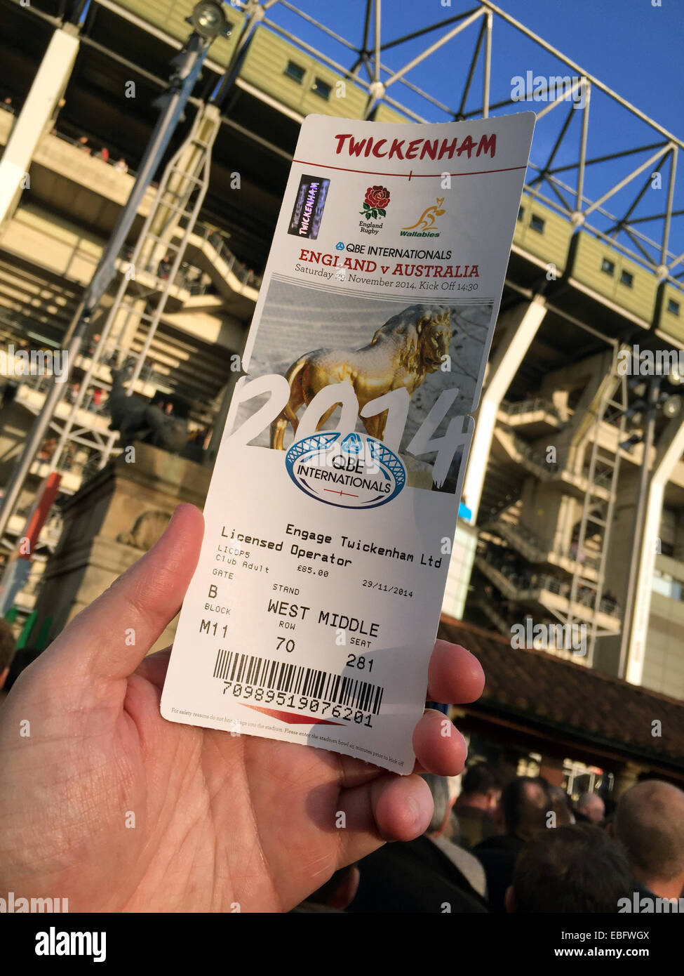 Holding an entrance ticket up at English Rugby at Twickenham, London, England, UK Stock Photo