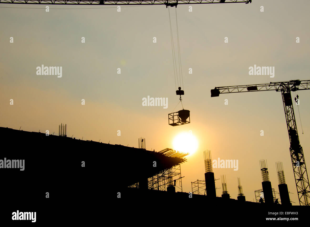 silhouette of crane for construction building Stock Photo