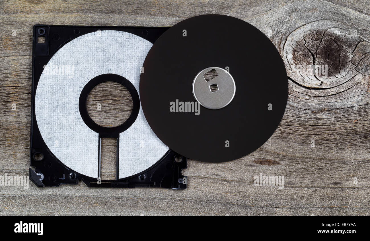 Inside parts of a computer diskette or floppy disk on rustic wood Stock ...