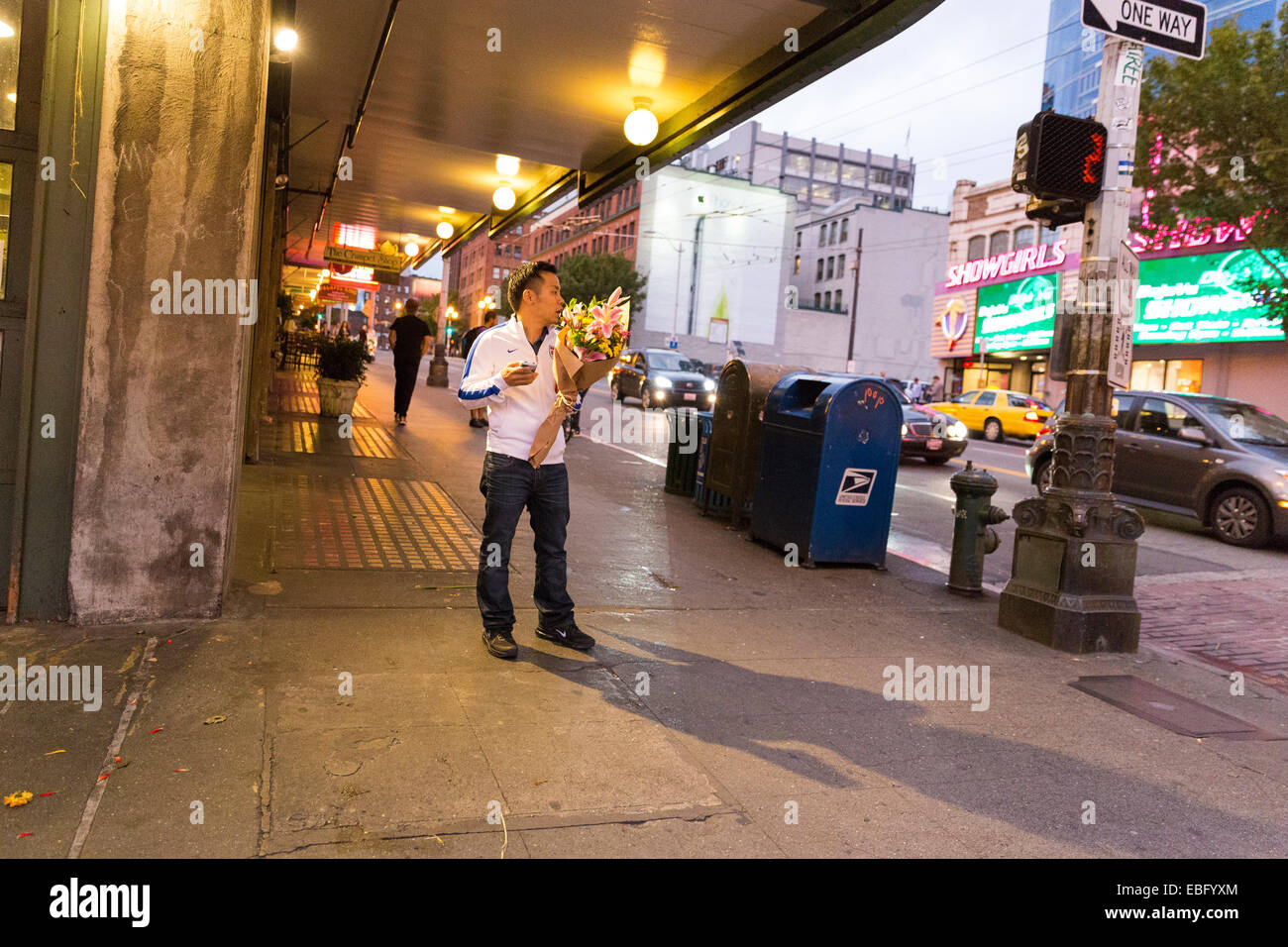 Man standing on the street hi-res stock photography and images - Alamy
