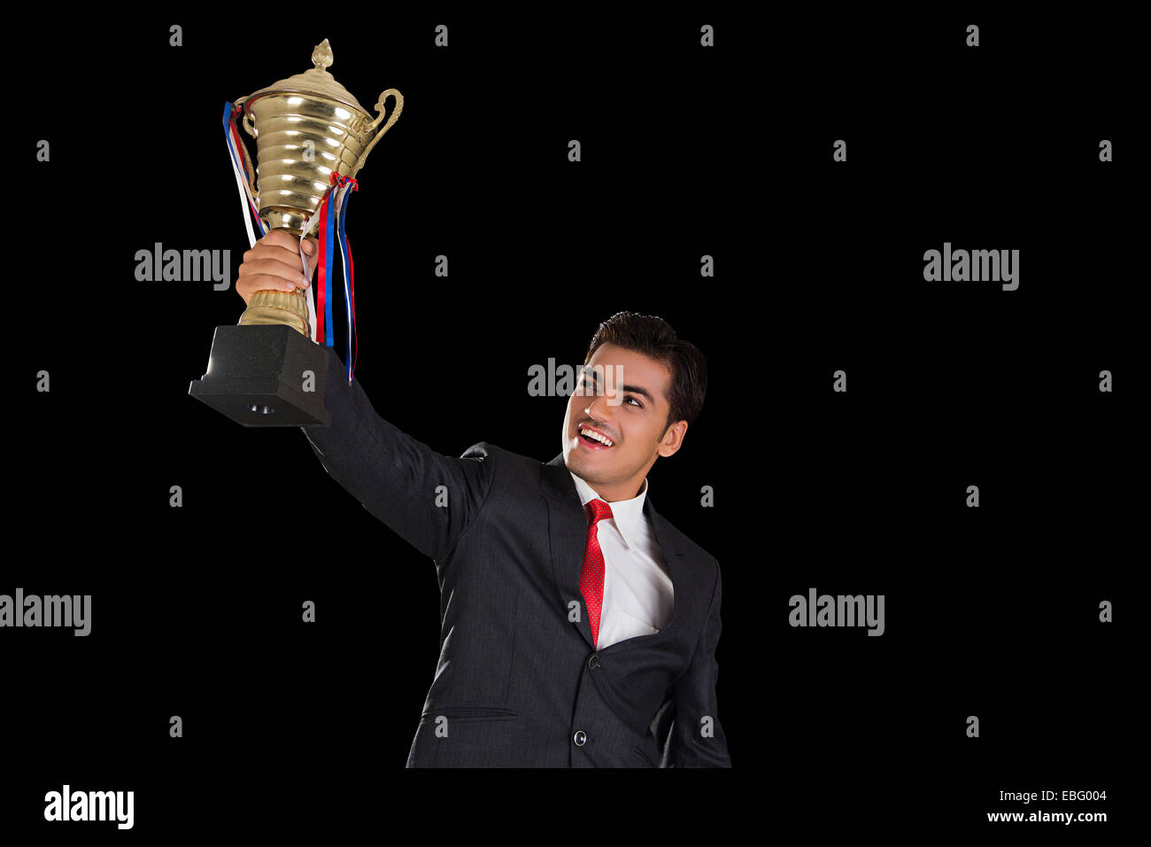 indian Business Man Victory Trophy Award Stock Photo