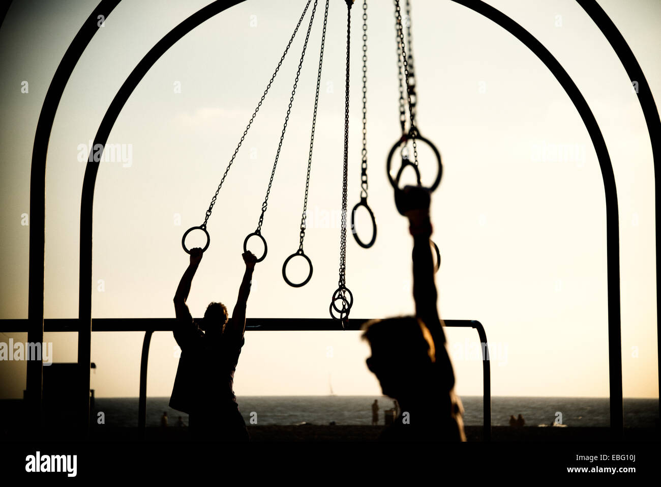 Tourists swinging on rings on the beach, Santa Monica Beach, Santa Monica, Los Angeles County, California, USA Stock Photo