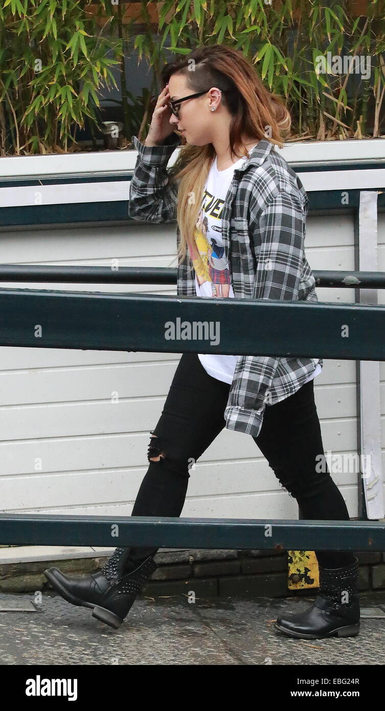 Demi Lovato at ITV studios wearing blue checked shirt, ripped jeans and  black studded boots Featuring: Demi Lovato Where: London, United Kingdom  When: 28 May 2014 Stock Photo - Alamy