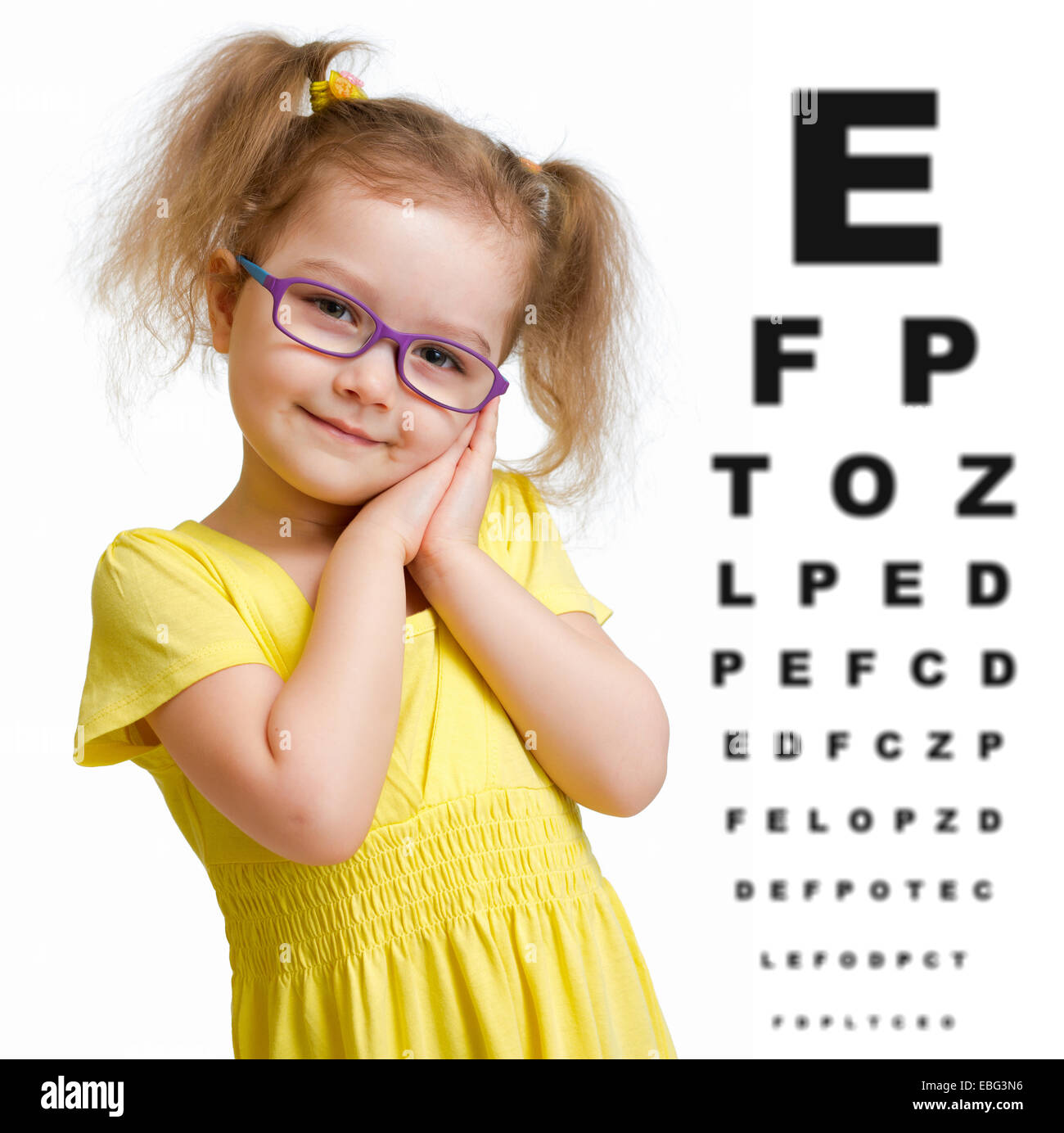 Smiling girl in glasses with eye chart isolated Stock Photo