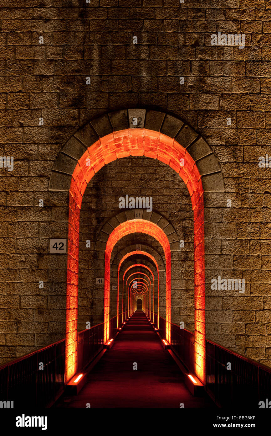 Path to Infinity. LED lights illuminating the 2nd floor of Chaumont's historic viaduct. Haute-Marne, Grand Est, France. Stock Photo