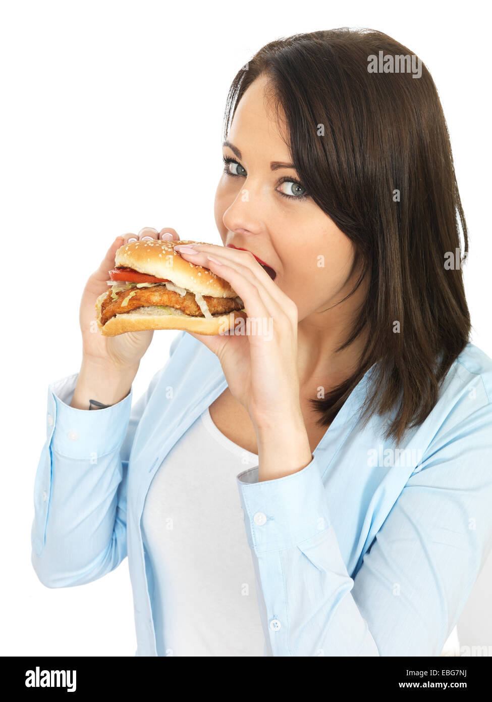 Attractive Twenty Something Young Woman Eating a Chicken Burger Stock