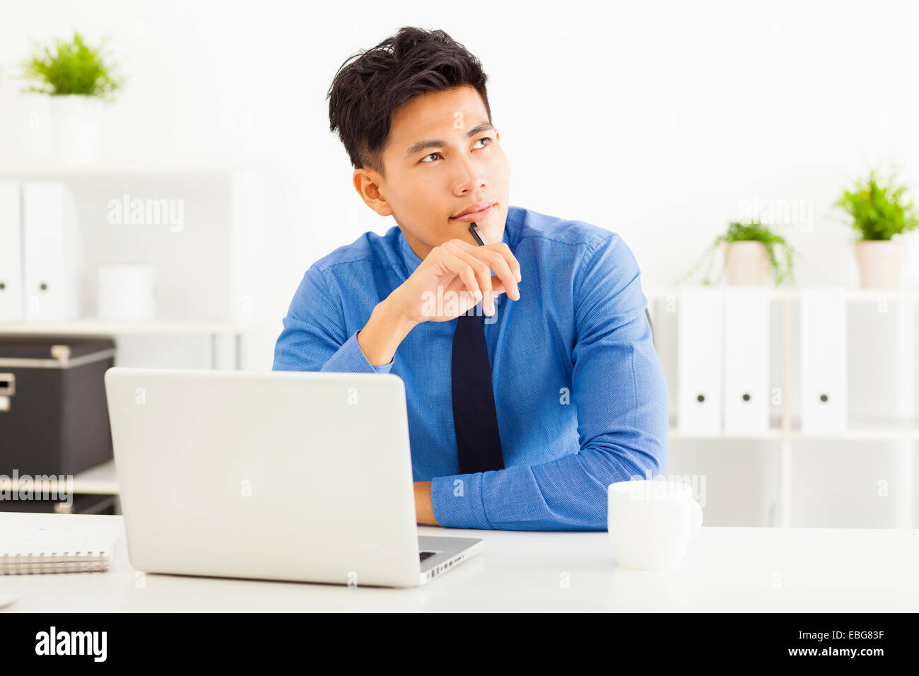Young asian businessman planning and thinking Stock Photo
