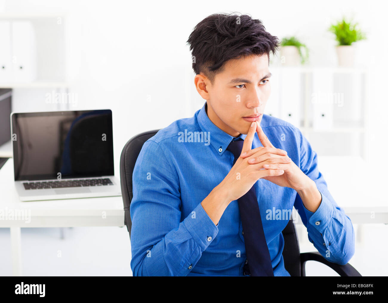 Young asian businessman  thinking plan in the office Stock Photo
