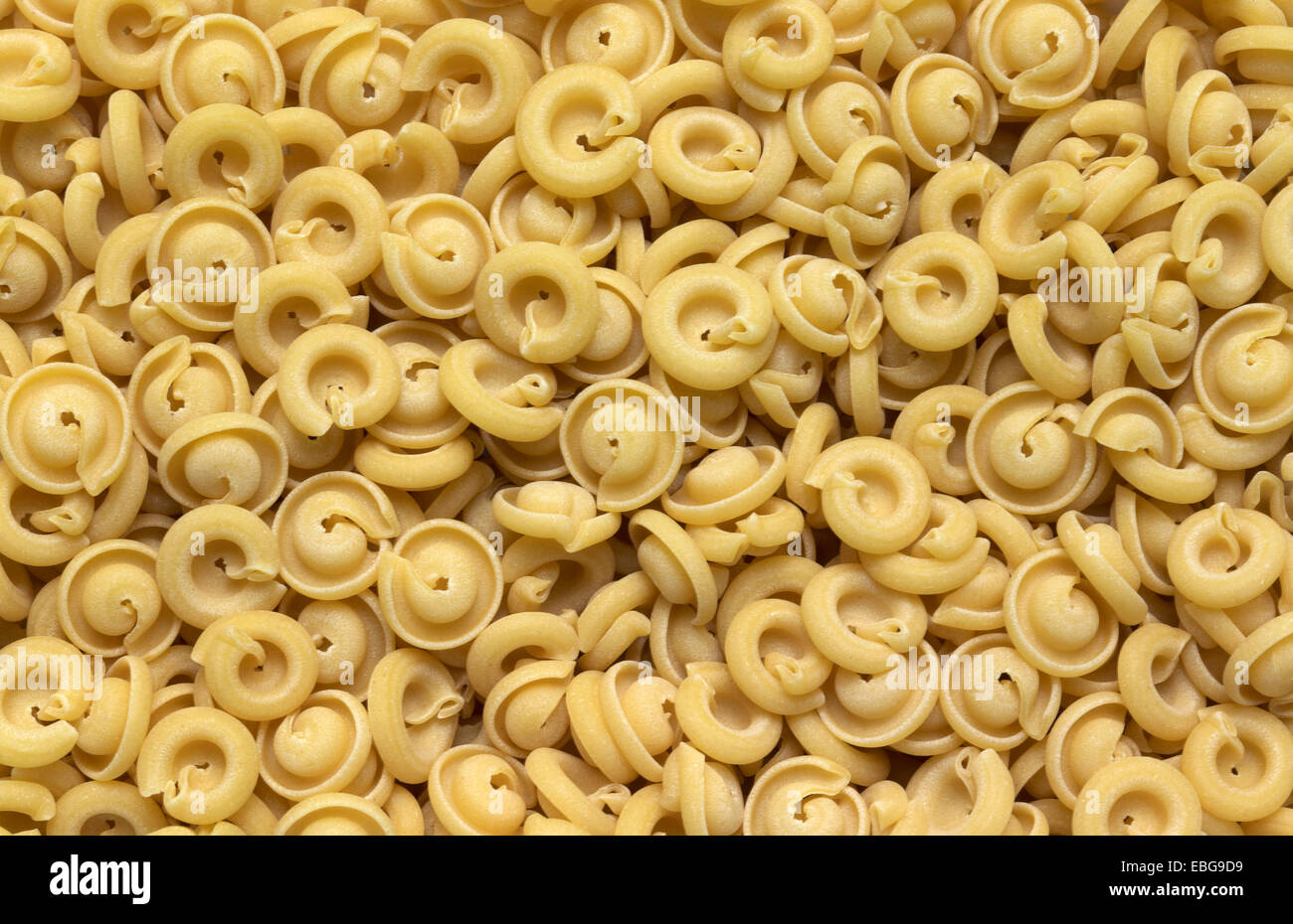 full frame italian pasta background with lots of Insalatonde noodles Stock Photo