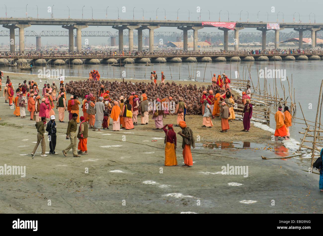 Sitting in silence as part of the initiation of new sadhus at the Sangam, the confluence of the rivers Ganges Stock Photo