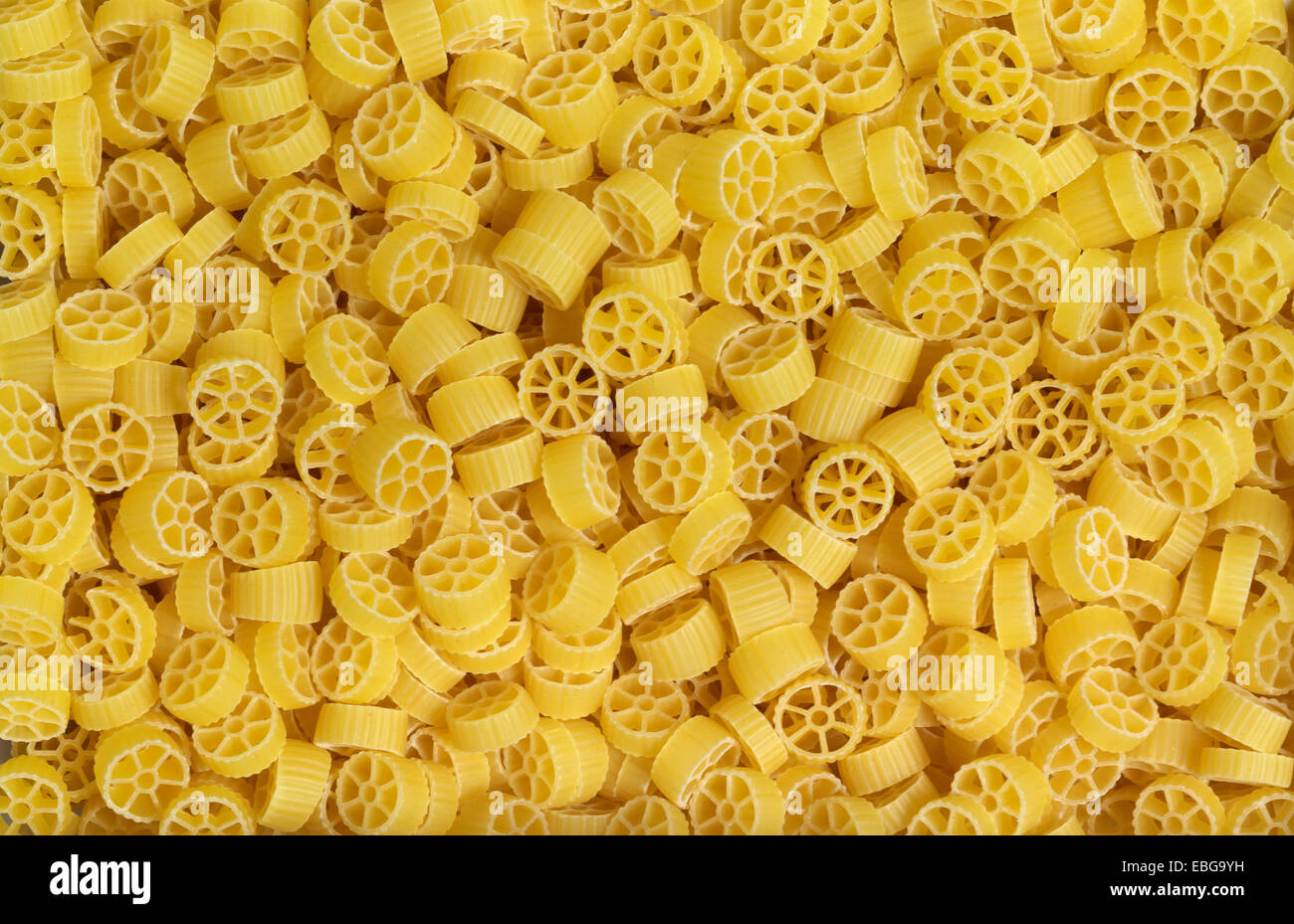 full frame italian pasta background with lots of Ruote noodles Stock Photo