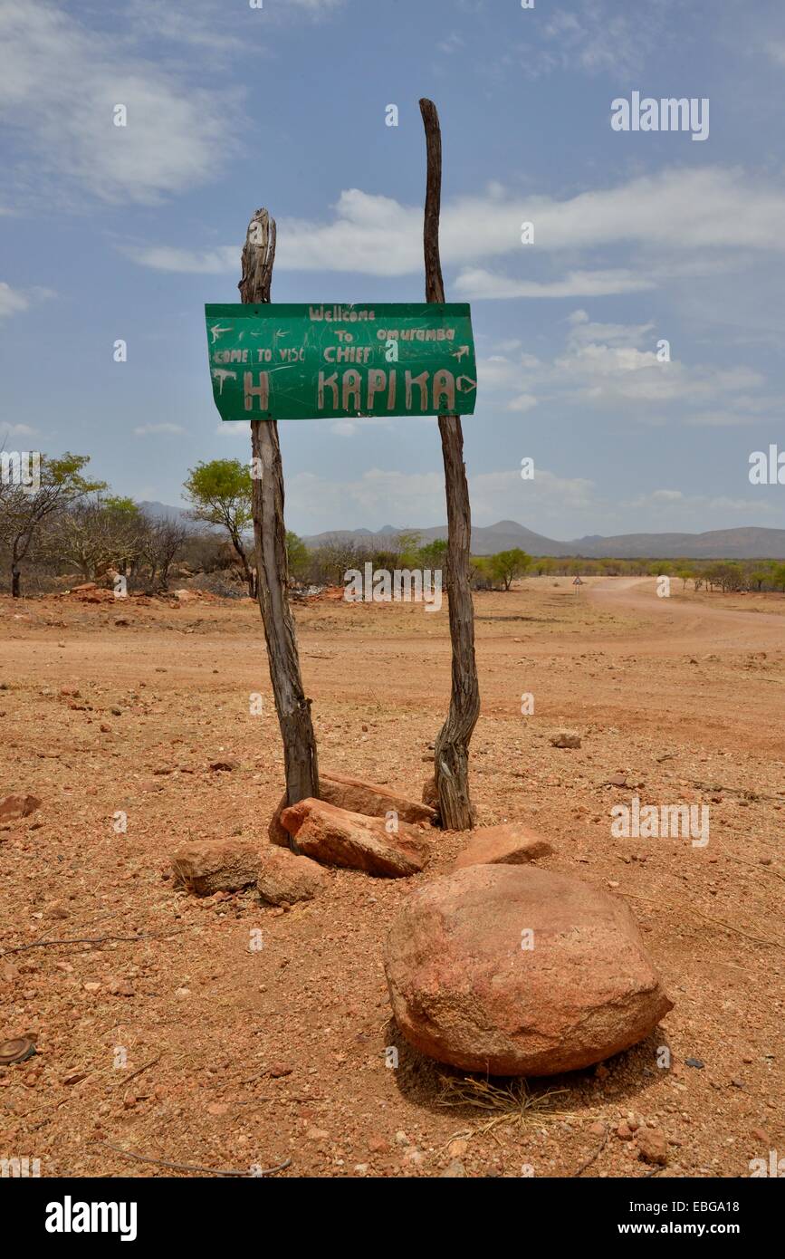Sign at the entrance to the village of Omuramba, residential village of Chief Hikuminue Kapika, the tribal leader of the Stock Photo