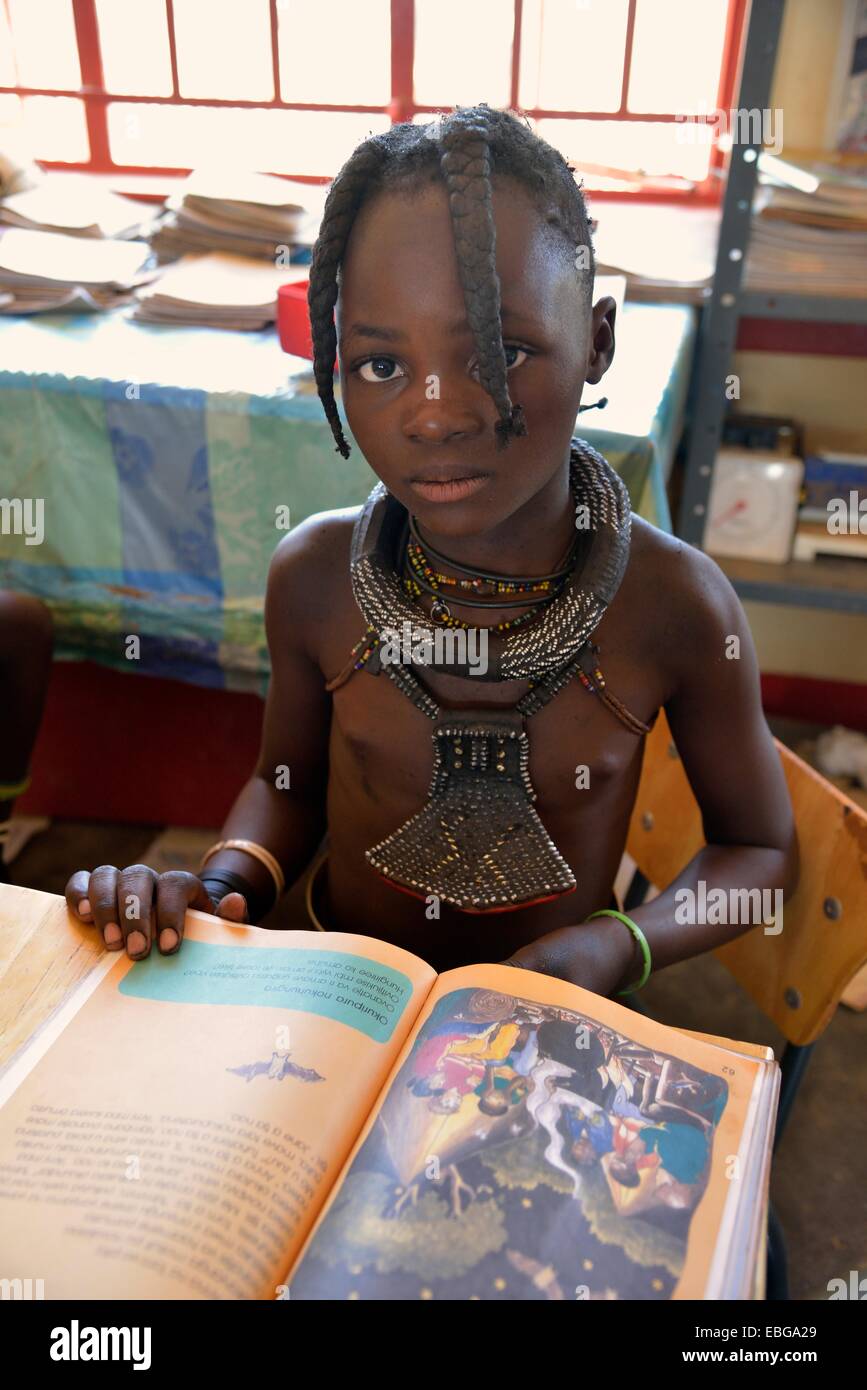 Girl, Himba pupil, sitting in a classroom at the Omohanga Primary School, Himba school, Omohanga, Kaokoland, Kunene, Namibia Stock Photo