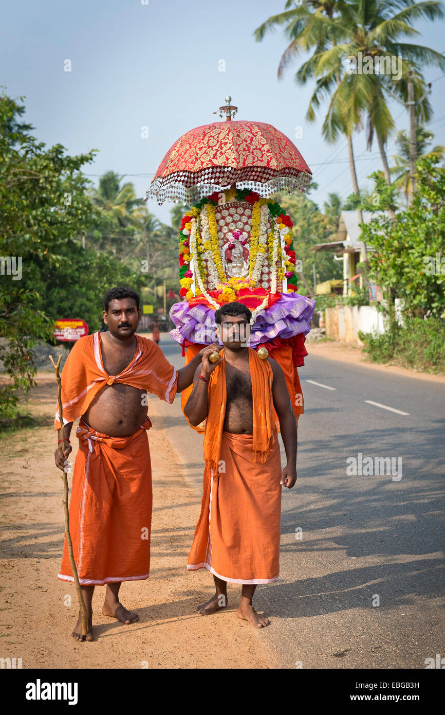 Procession of Hindu pilgrims in honor of a local patron goddess, Vembanad lake, Kerala, India Stock Photo