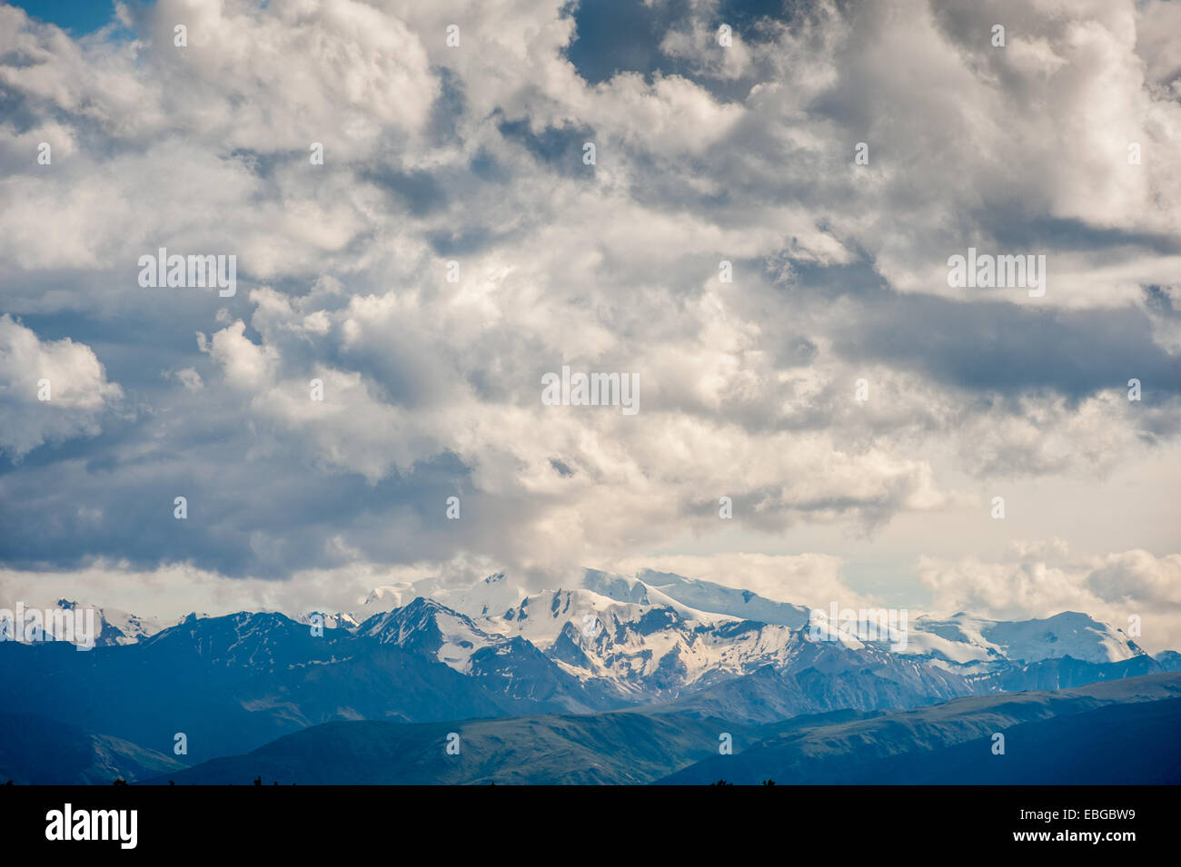 Alaskan mountain range being eclipse with heavy cloud cover Stock Photo