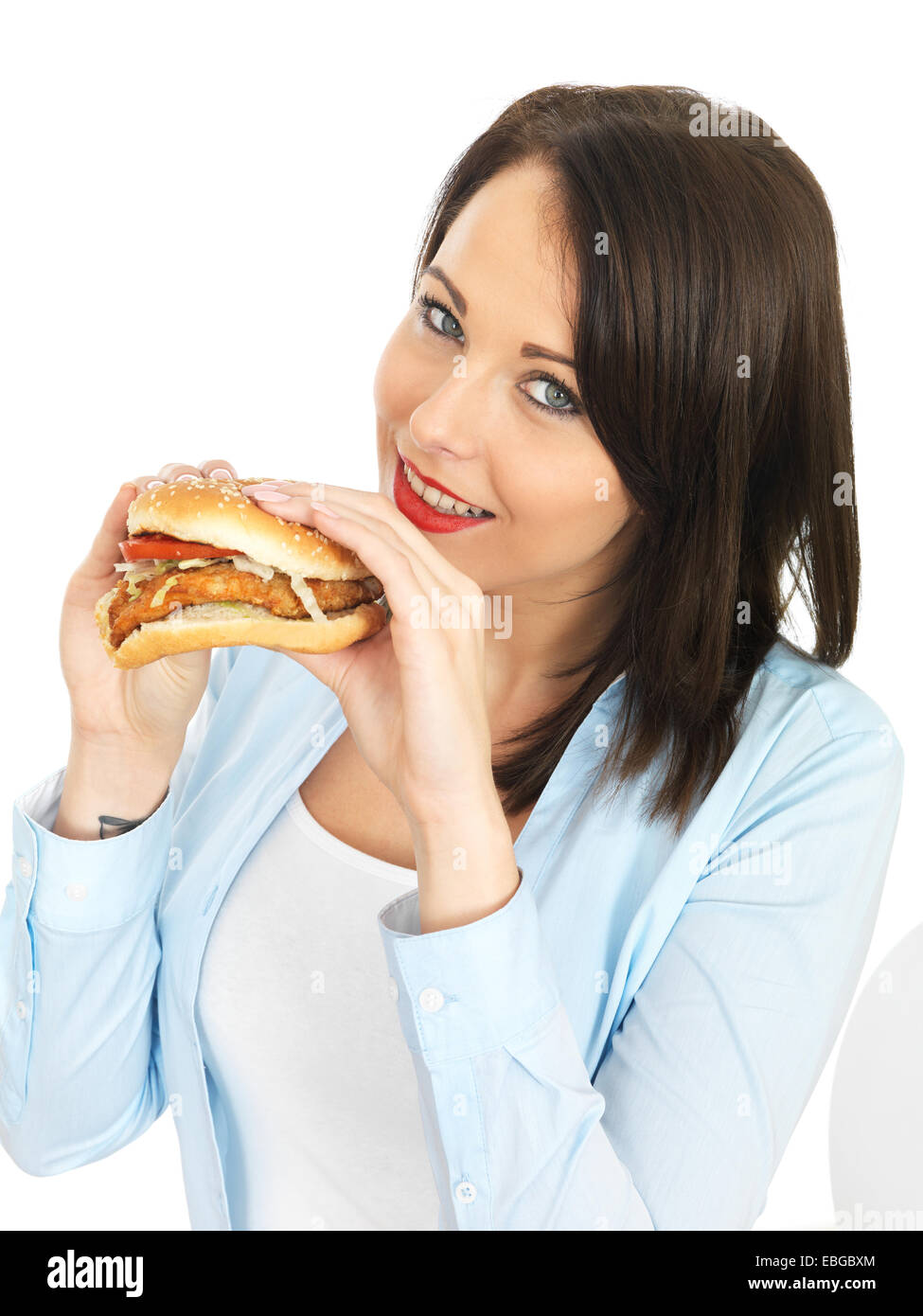 Attractive Twenty Something Young Woman Eating a Chicken Burger Stock Photo