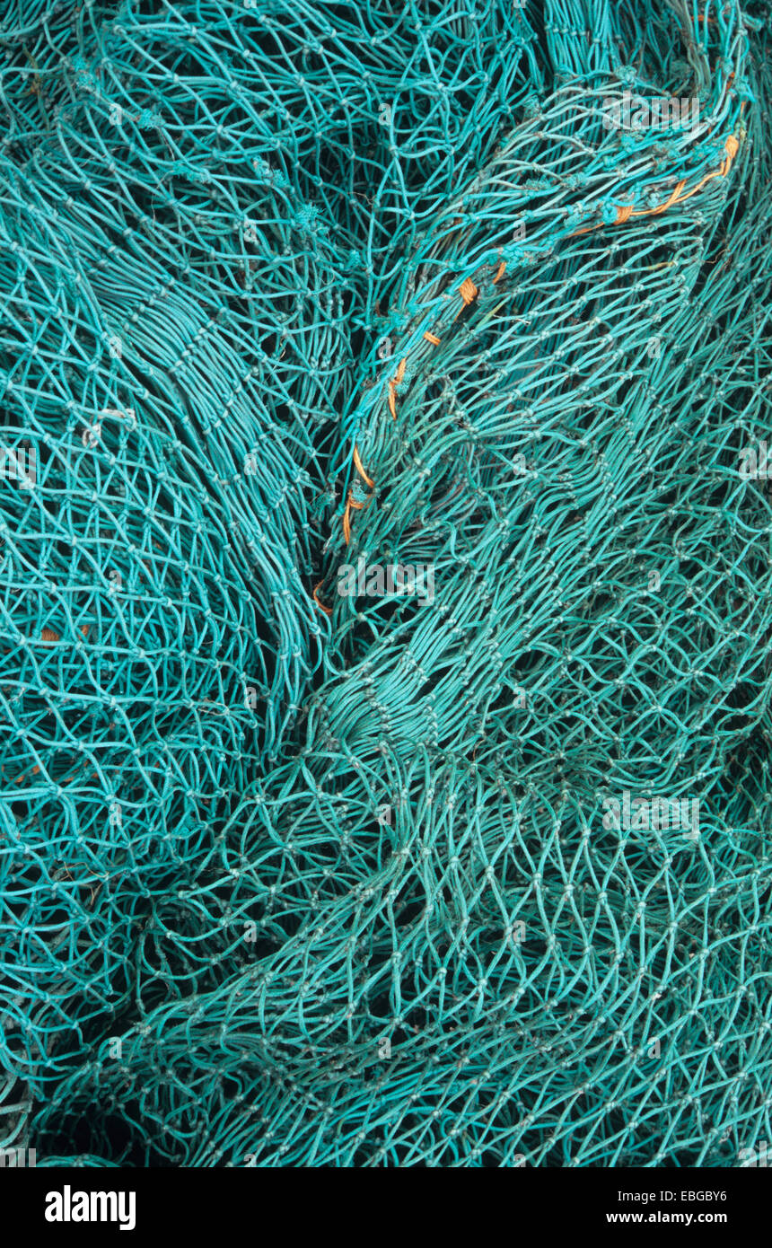 Detail of blue-green nylon fishing net with orange nylon rope