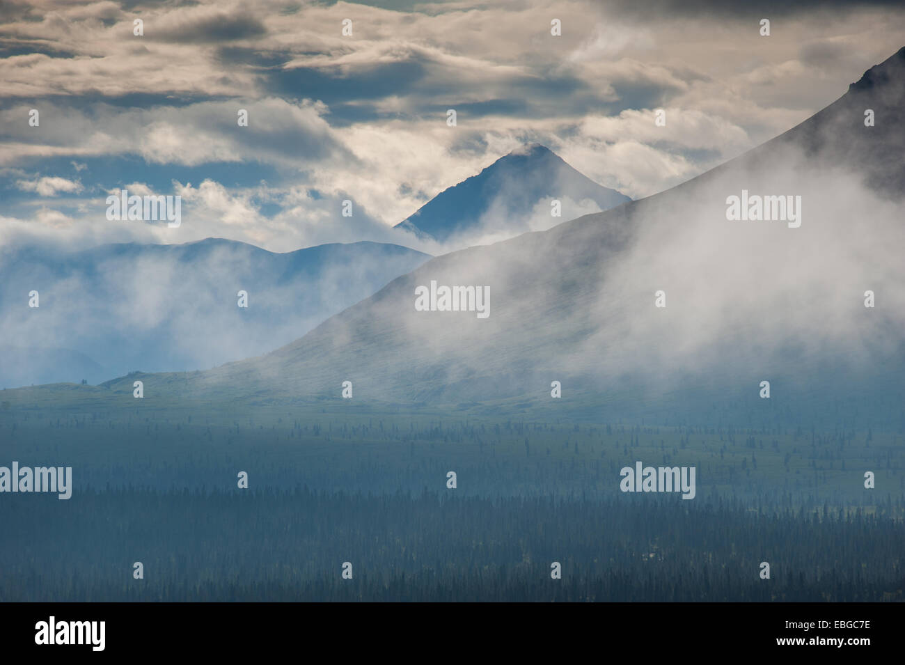 Alaskan mountain range obscured by afternoon haze Stock Photo