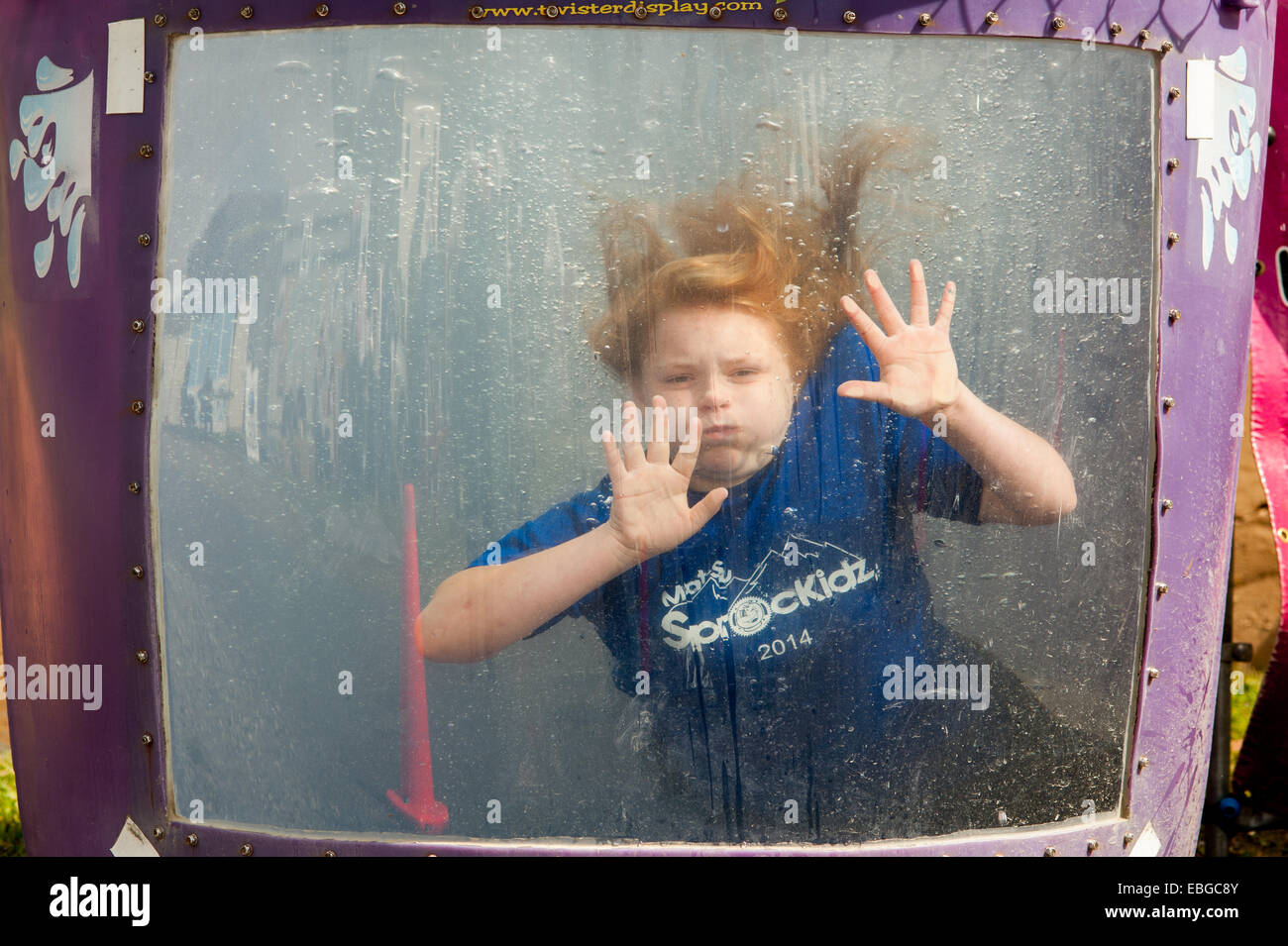 Girl being dunked into a bin of water at an event in Alaska Stock Photo