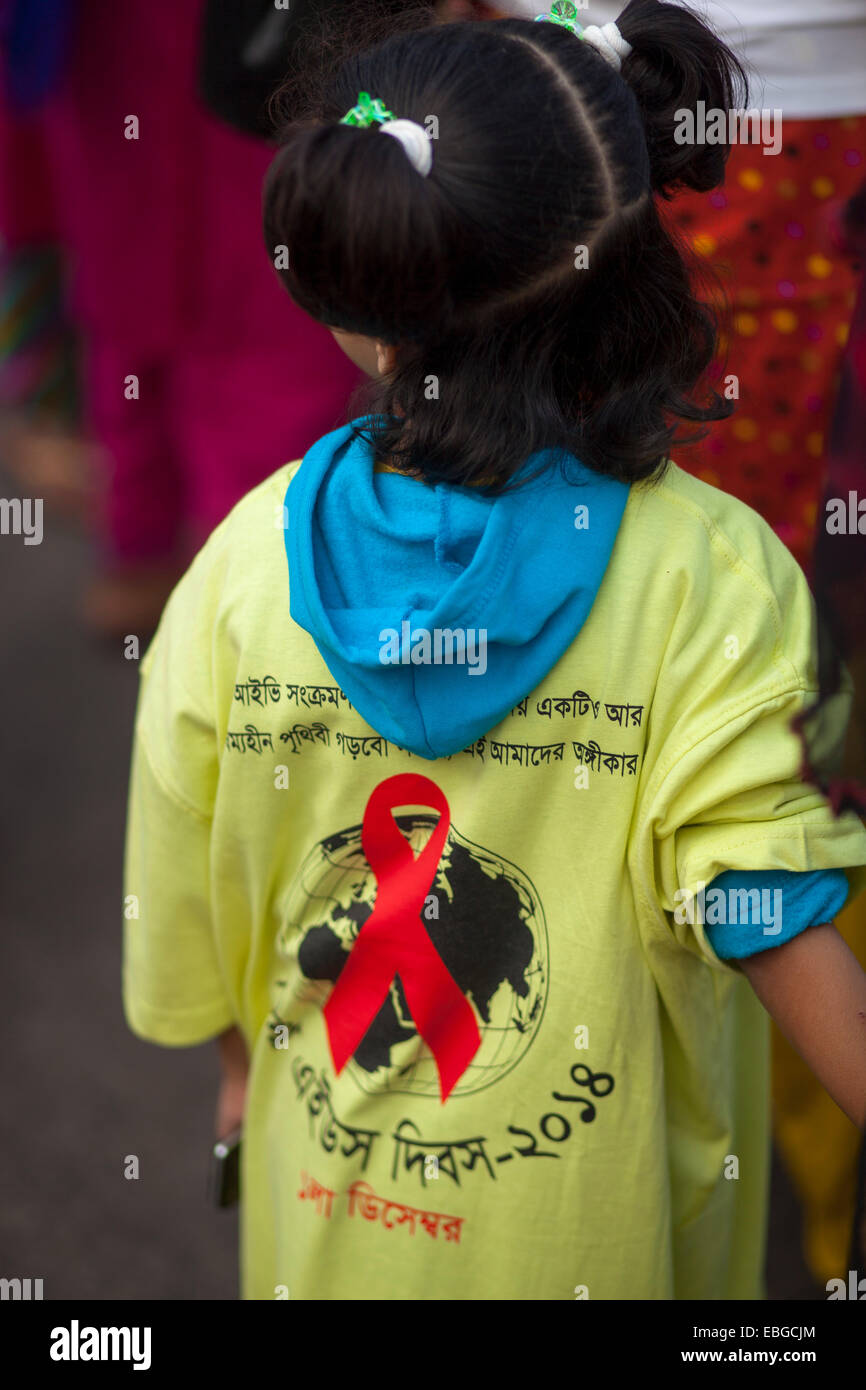 Dhaka, Bangladesh. 1st December, 2014. A child attended a rally in Dhaka to aware people from HIV/AIDS on the occasion of 'World AIDS Day'. According to latest government figures, a total of 3,241 HIV-positive patients have been identified in Bangladesh since 1989, among who 1,299 became AIDS patients and 472 died while the UN estimates the number to be between even higher, between 8,000 and 16,000. Credit:  zakir hossain chowdhury zakir/Alamy Live News Stock Photo