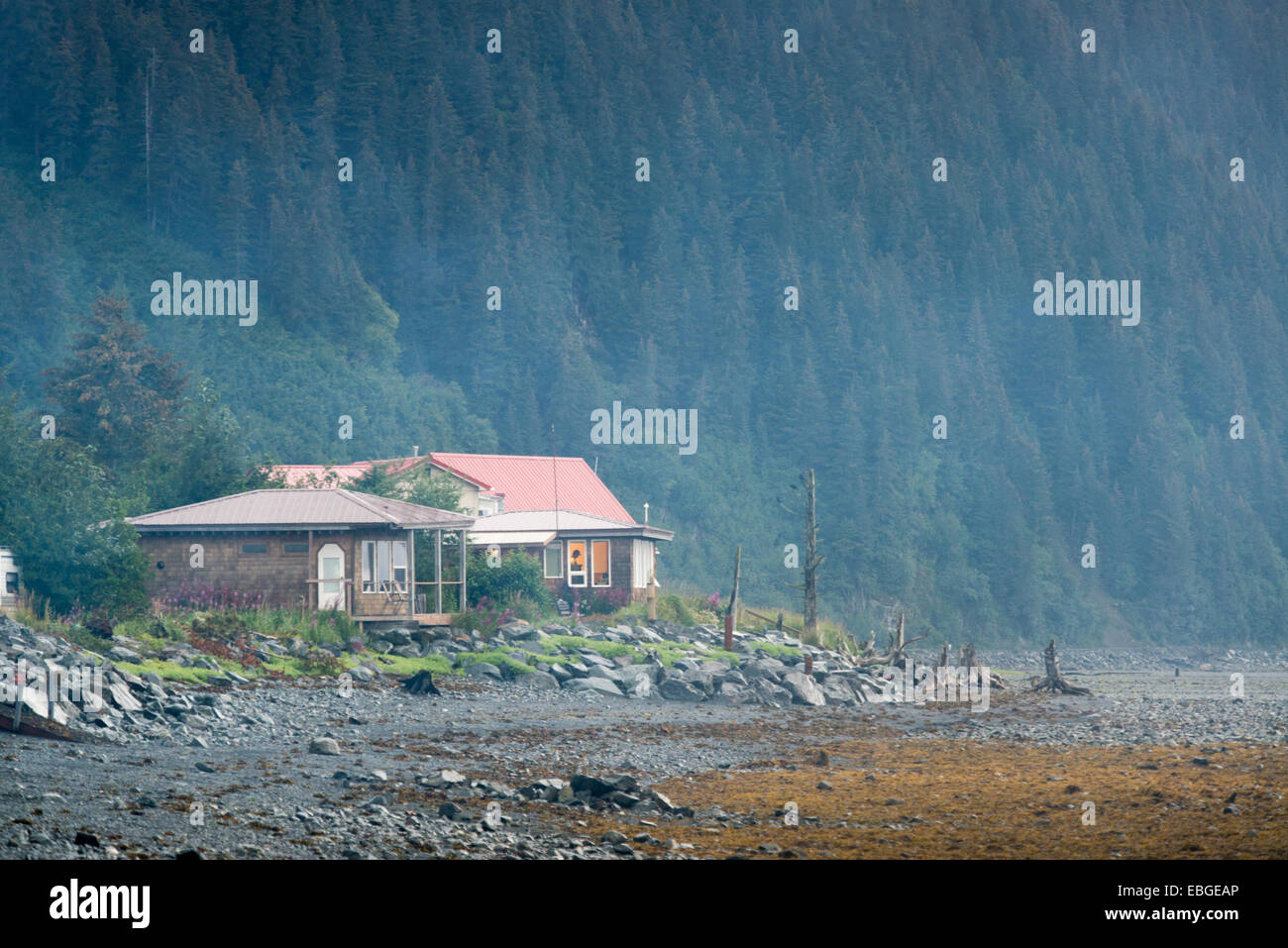 Cottage home at the base of a mountain in Seward, Alaska Stock Photo