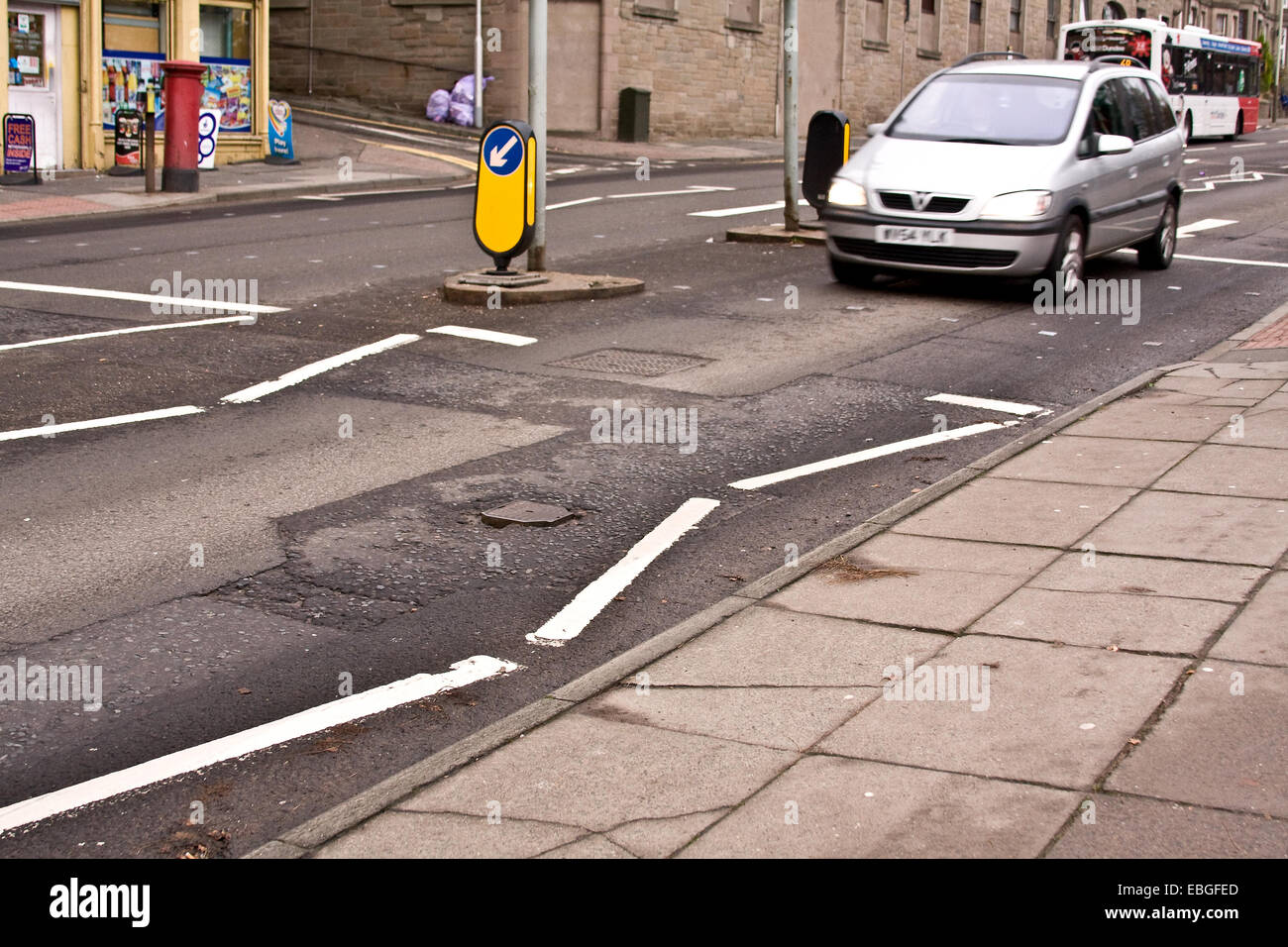 Dundee, Scotland, UK. 1st December, 2014. Councils are being invited to bid for a share of a £168 million Pothole Fund to repair local roads, making them safer and smoother for motorists, cyclists and other road users. Scottish roads are considered to be amongst the worst in the UK. Road surfaces are laid with cheap tarmac that crack with the high volume of traffic and bad weather. Credit:  Dundee Photographics/Alamy Live News Stock Photo