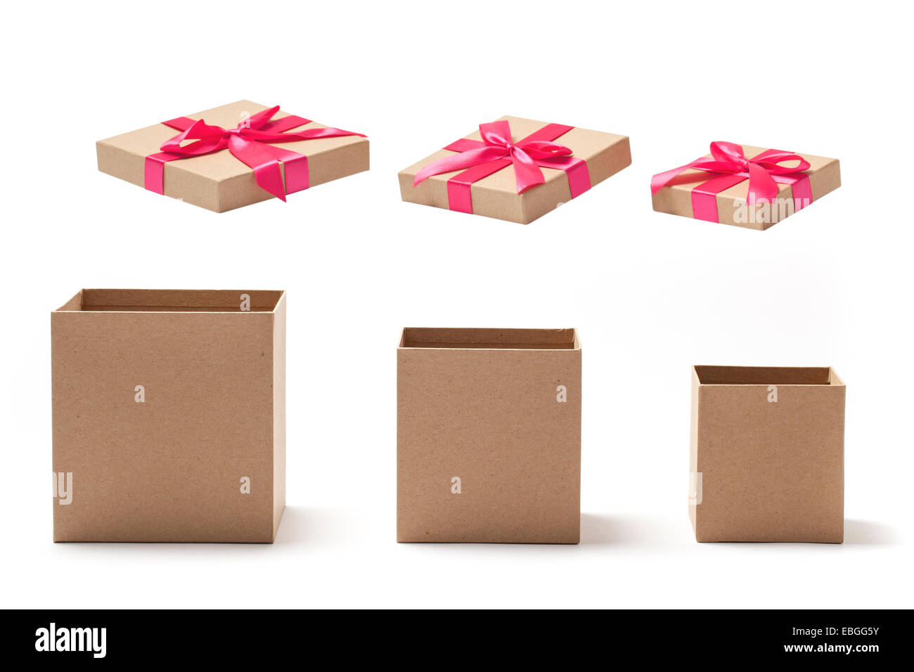 Open empty gift boxes with red ribbons isolated on white Stock Photo