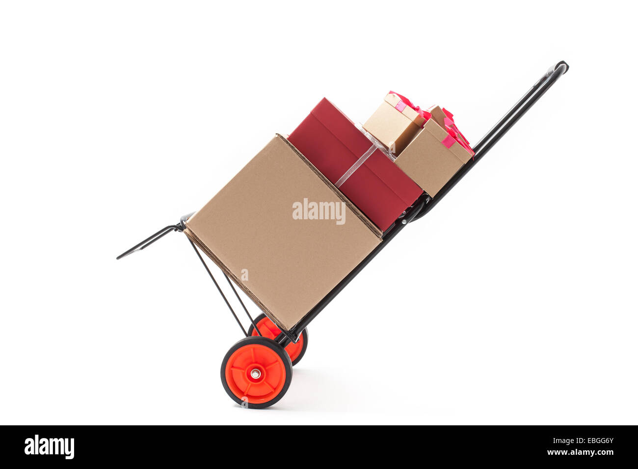 Hand truck - dolly with several gift boxes isolated on white Stock Photo