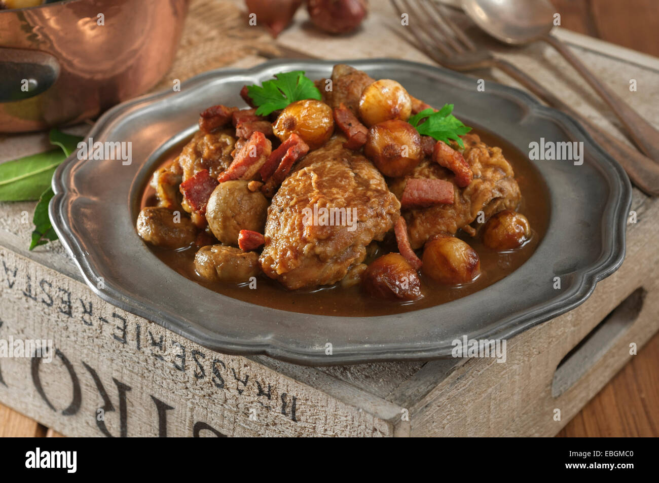 Coq au vin. Chicken cooked with red wine. France Food Stock Photo