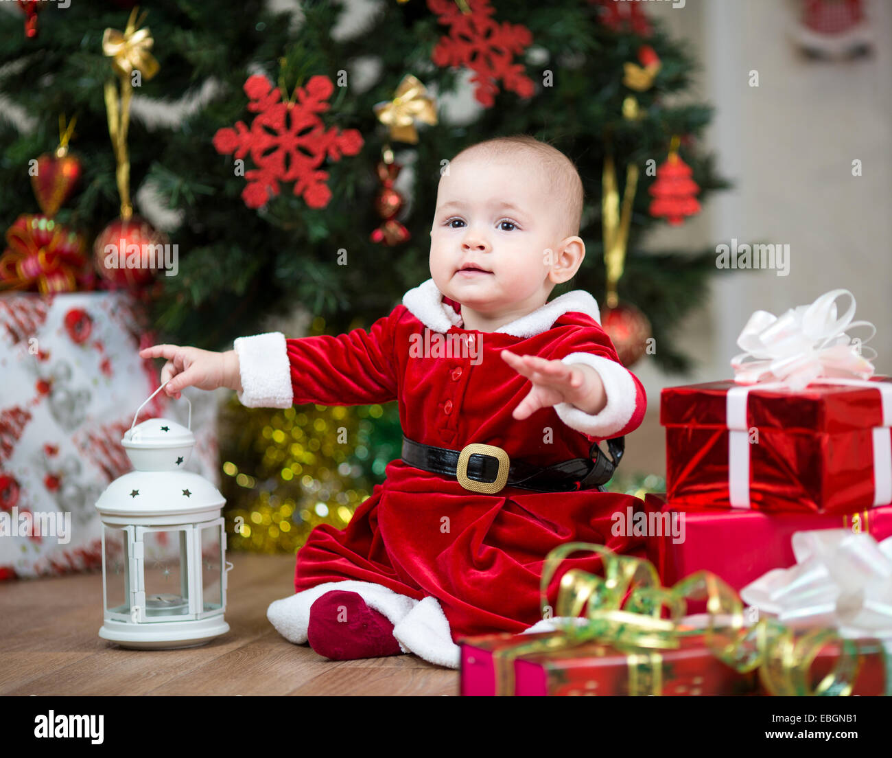 kid with Christmas gift boxes Stock Photo