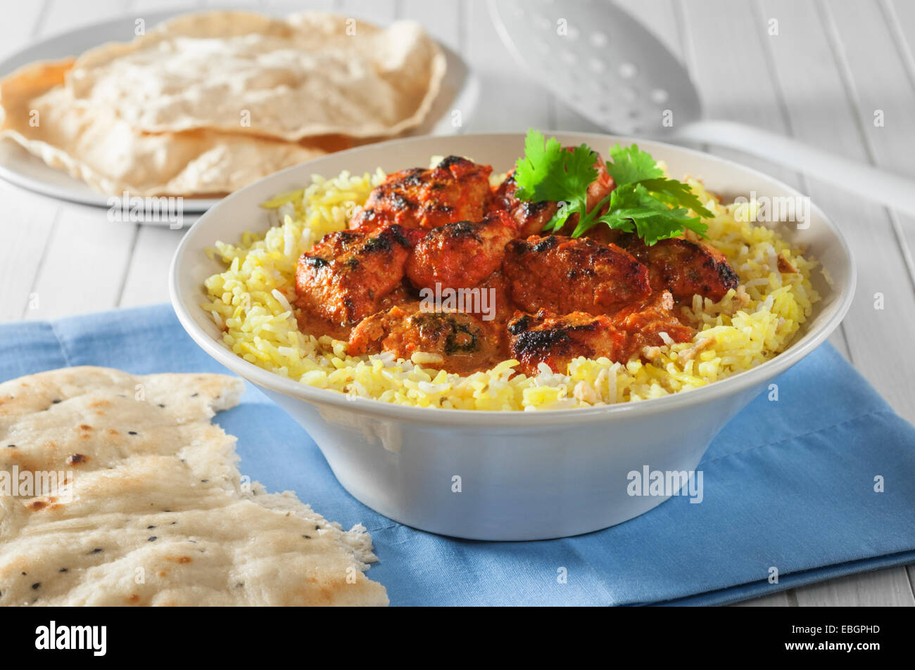 Chicken tikka masala with rice and naan bread. Stock Photo
