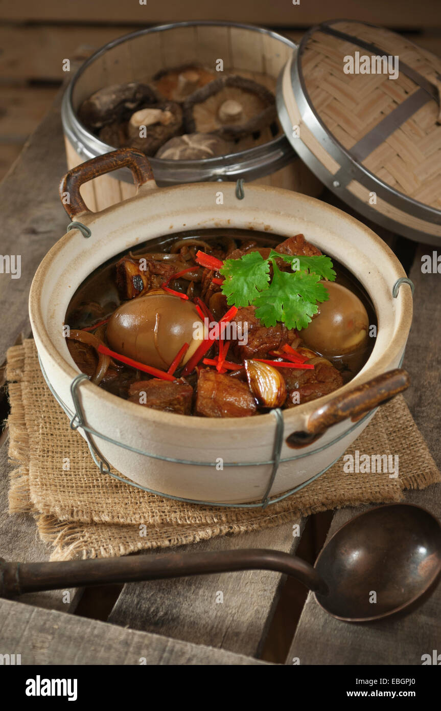 Vietnamese braised pork with eggs. Thit heo kho trung Stock Photo