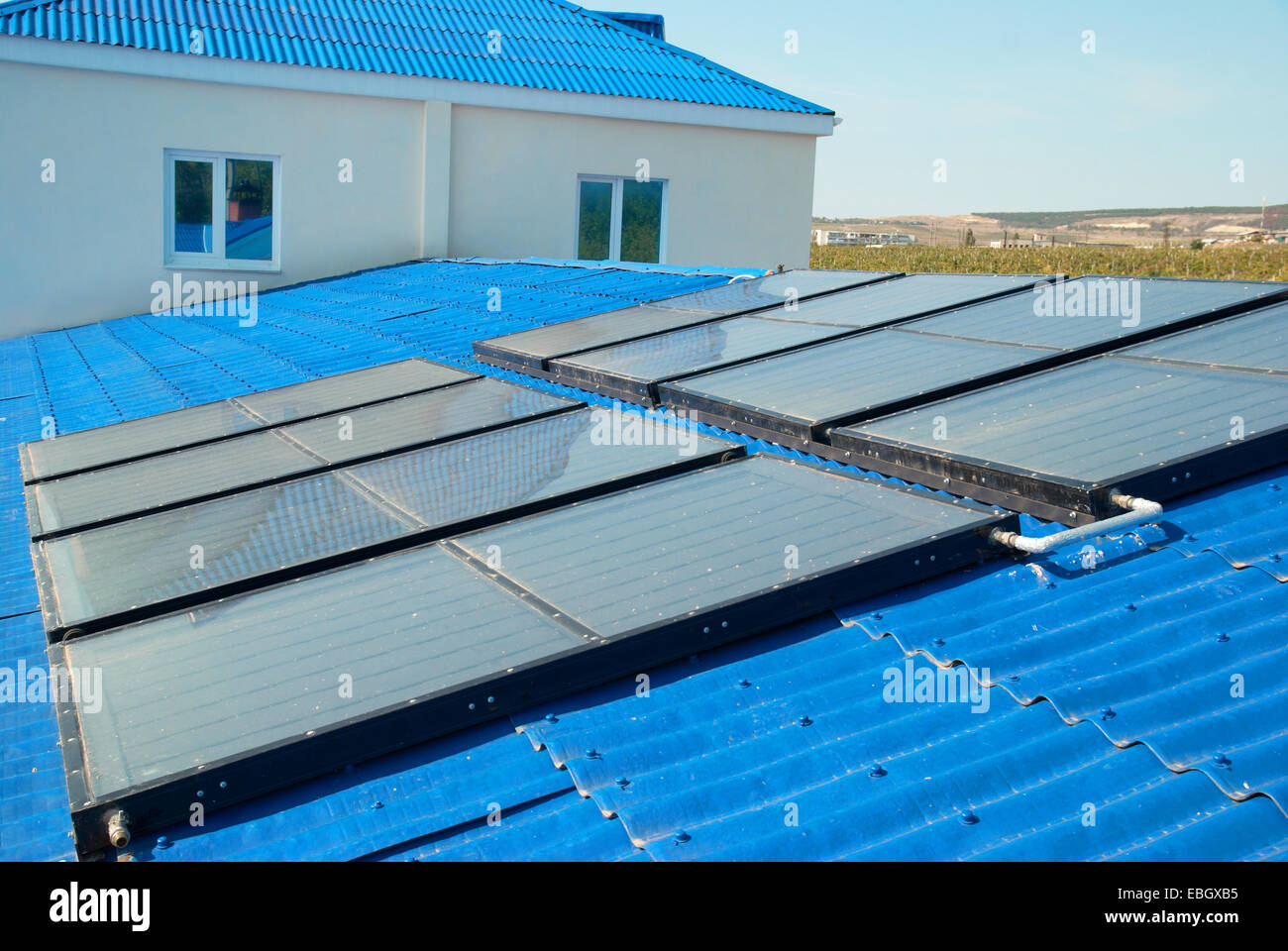 Solar water heating system on the house roof Stock Photo - Alamy