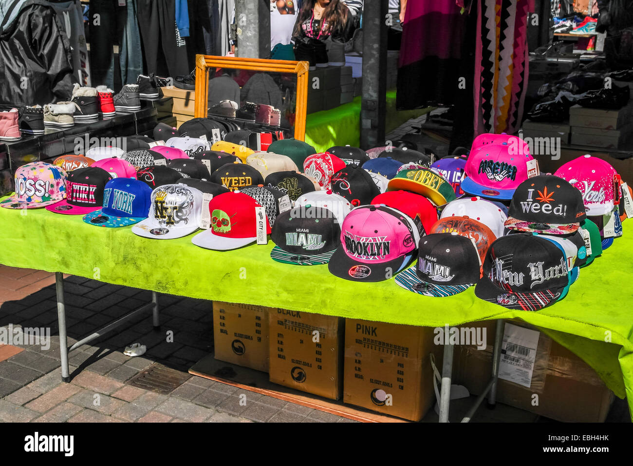 Various baseball caps on sale at the Leeds outdoor market Stock Photo Alamy