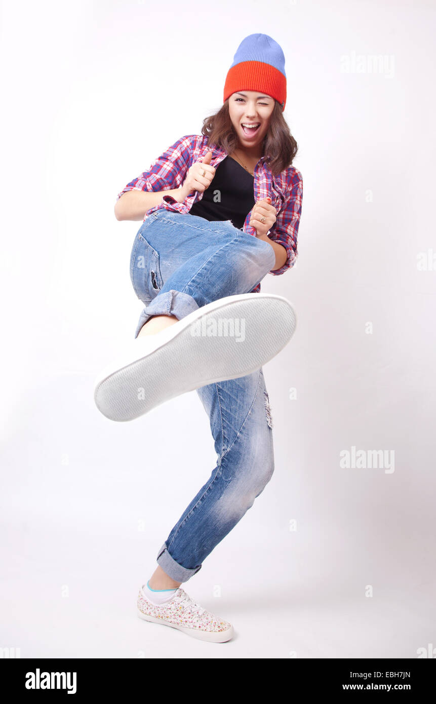 Teenage girl in torn jeans Stock Photo