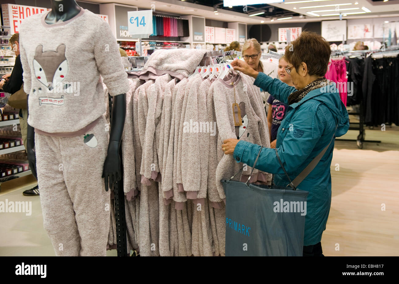 ENSCHEDE, NETHERLANDS - AUG 19, 2014: People are shopping in a new branch of warehouse Primark on the first day at the opening Stock Photo