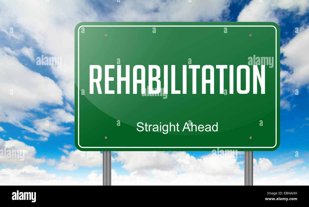 Highway Signpost with Rehabilitation  Wording on Sky Background. Stock Photo