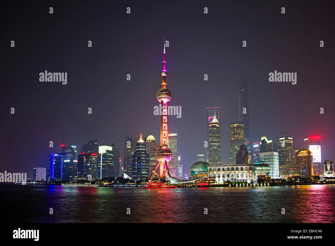 skyline of Pudong with illuminated television tower at night, China, Shanghai Stock Photo