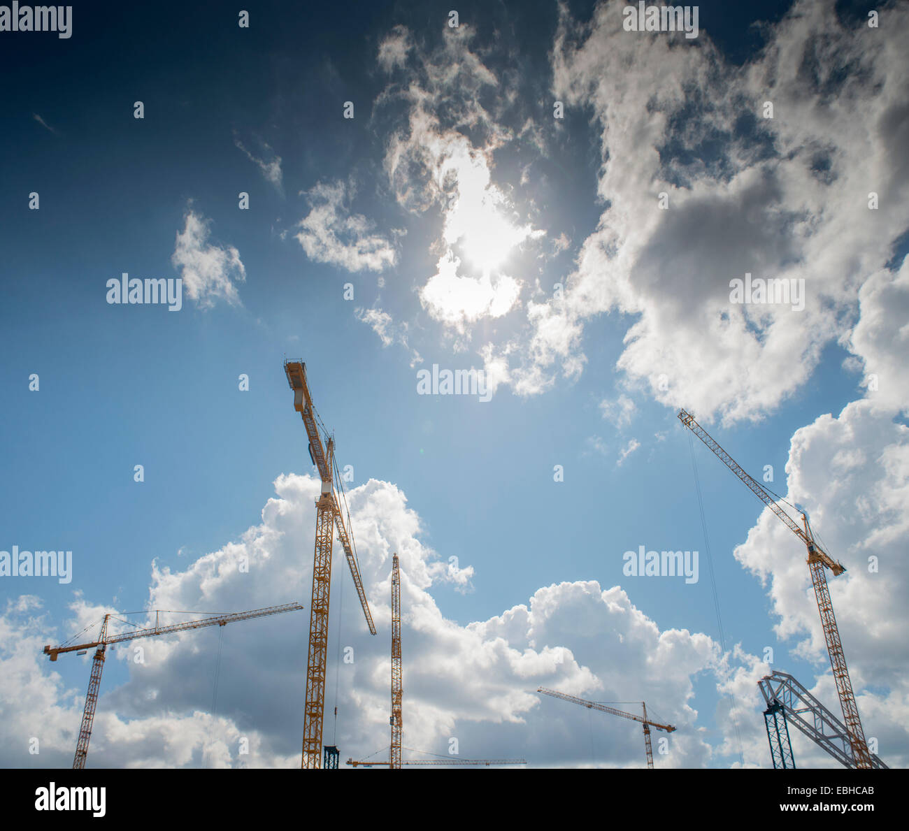 Cranes against sky Stock Photo